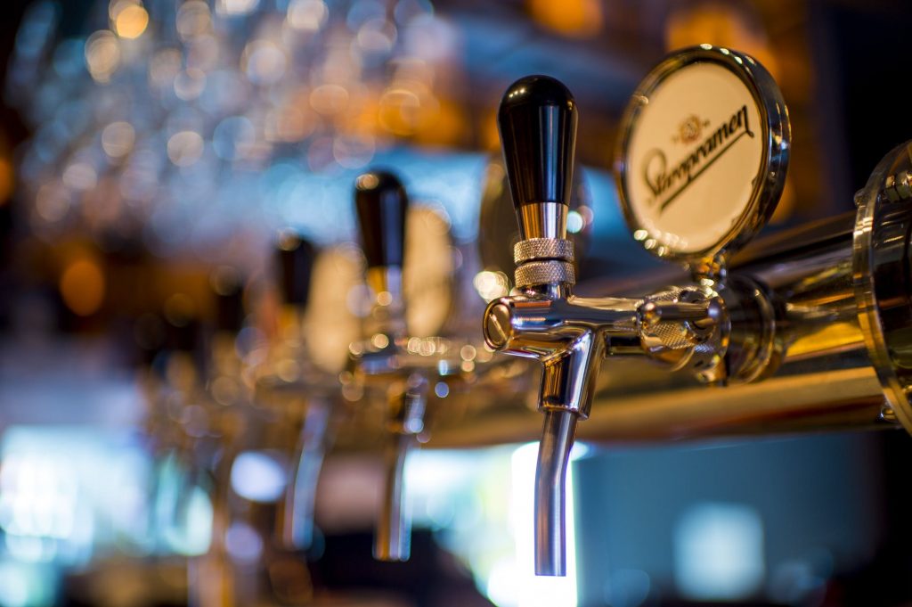 Up close of a draft dispenser at a brewery